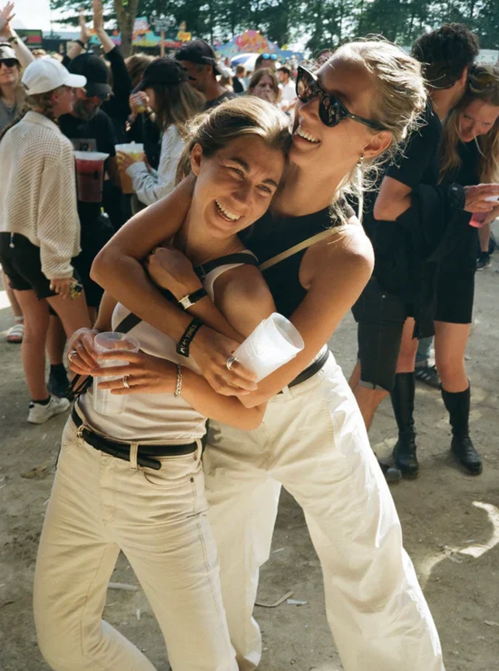We don't recommend wearing white pants to a dusty and dirty festival ;) Amalie wearing The Caroline Earrings and the Sofie Ring in silver. Nanna is wearing two stacked Nanna rings named after her